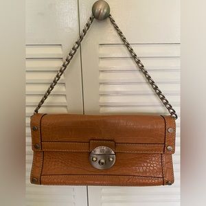 Michael Kors vintage light brown clutch.